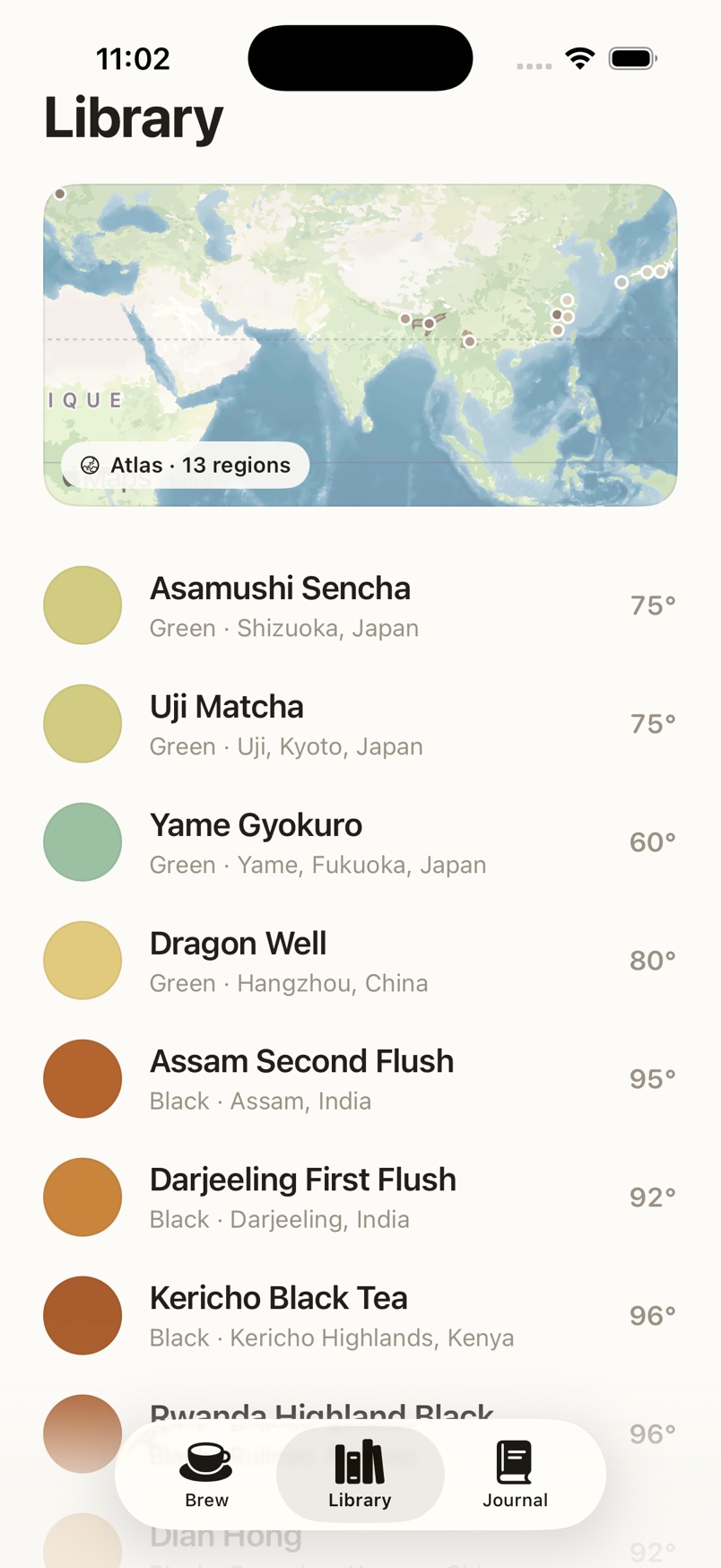 Pekoe library with a world atlas and teas by region